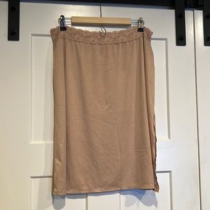 Nude size XL slip skirt with back slit